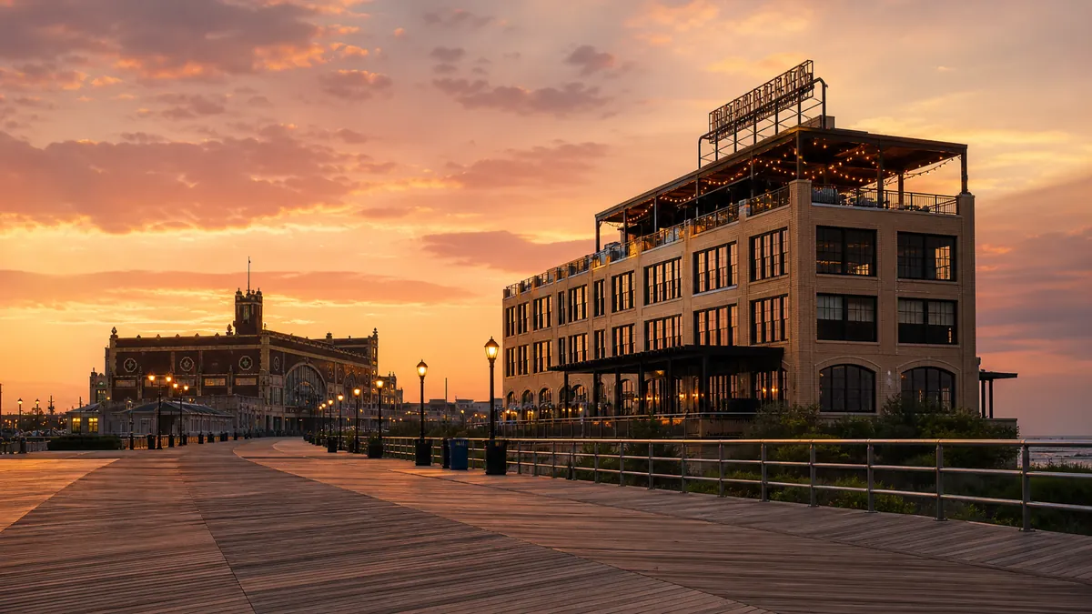 Best hotels in Asbury Park boardwalk and hotel facade at sunset